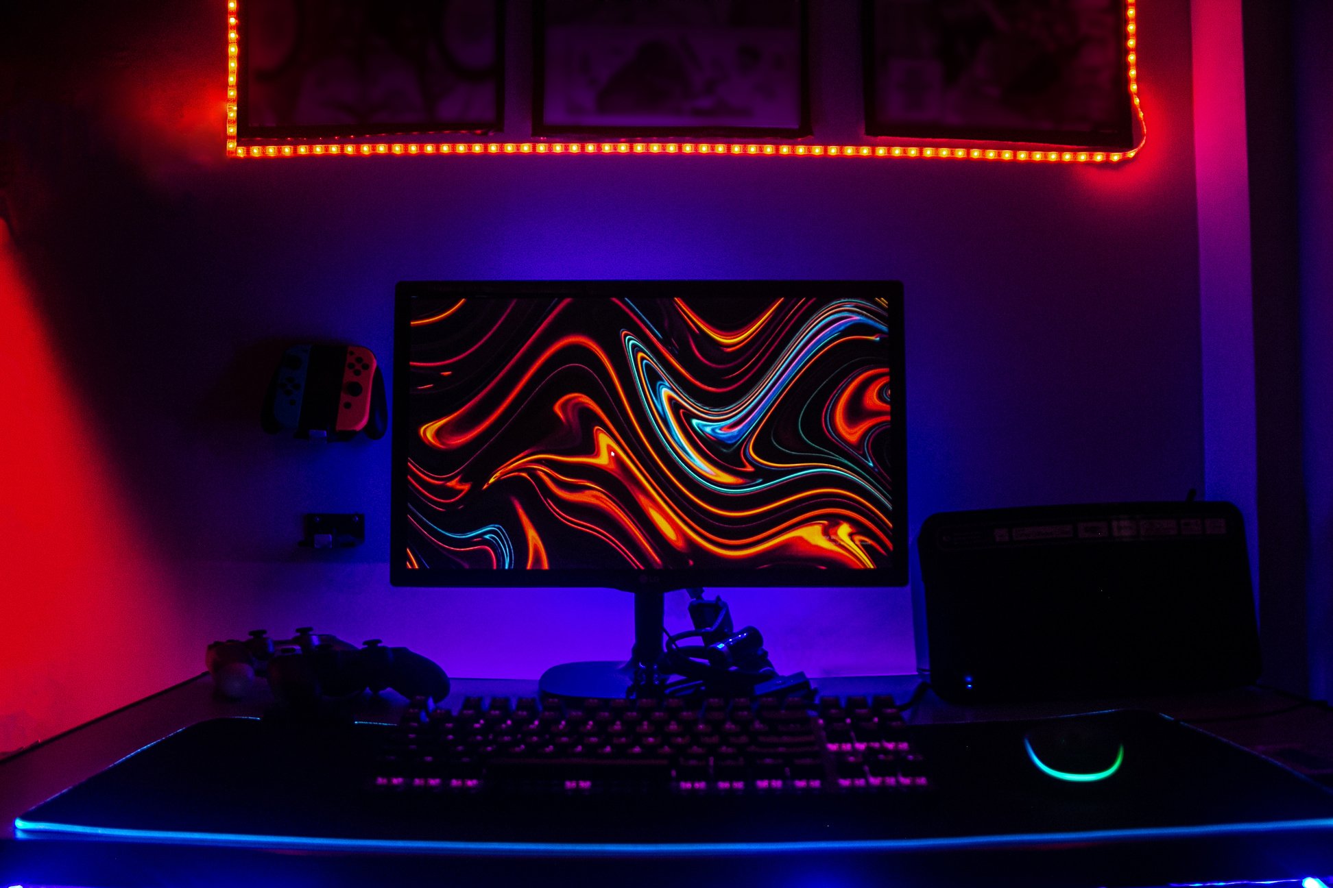 Computer Monitor with Game Controllers and Keyboard on the Table