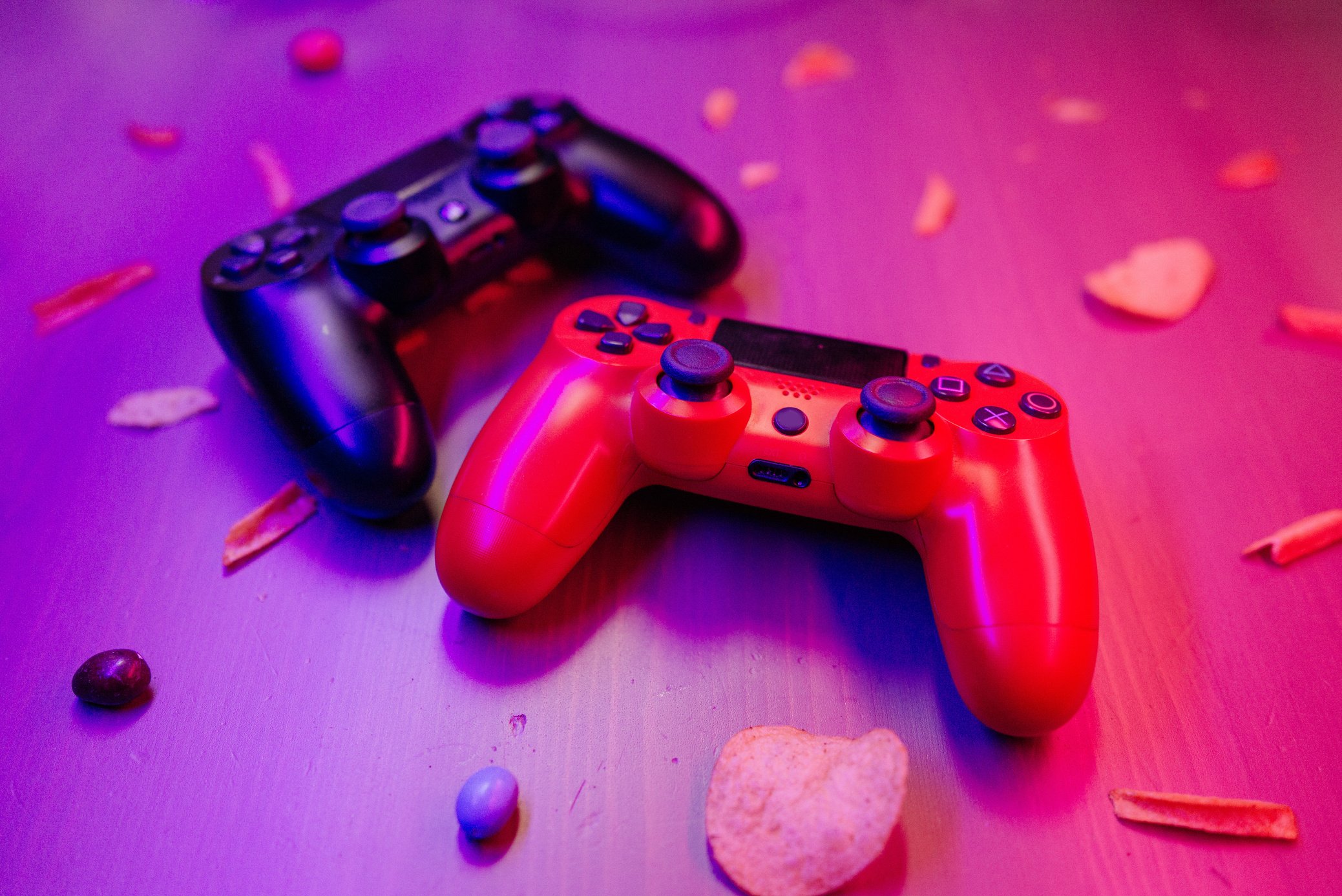 Close-Up Shot of Black and Red Game Controllers